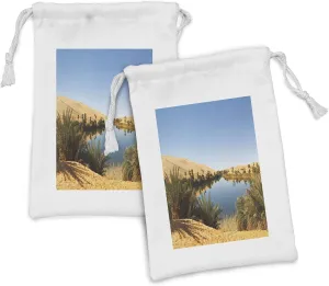 Ambesonne Desert Fabric Pouch Set of 2, Idyllic Oasis Awbari Sand Sea Sahara Libya Pond Arid Country, Small Drawstring Bag for Toiletries Masks and Favors, 9" x 6", Sand Brown Pale Blue